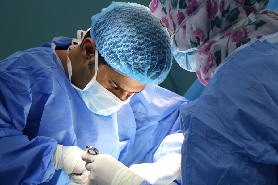 doctor having a operation in operating room